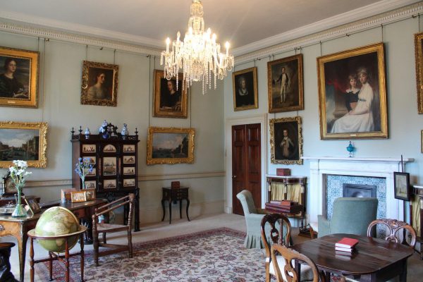 Kiplin Hall Drawing Room with paintings across the walls