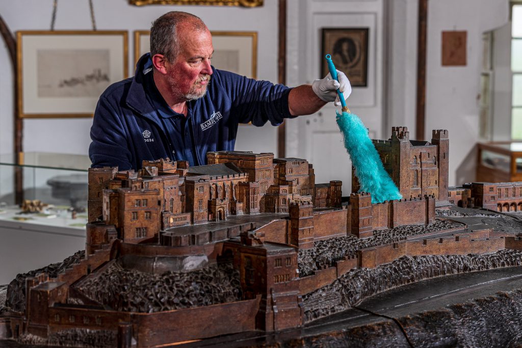 Bamburgh Castle Preparing for opening dusting model castle