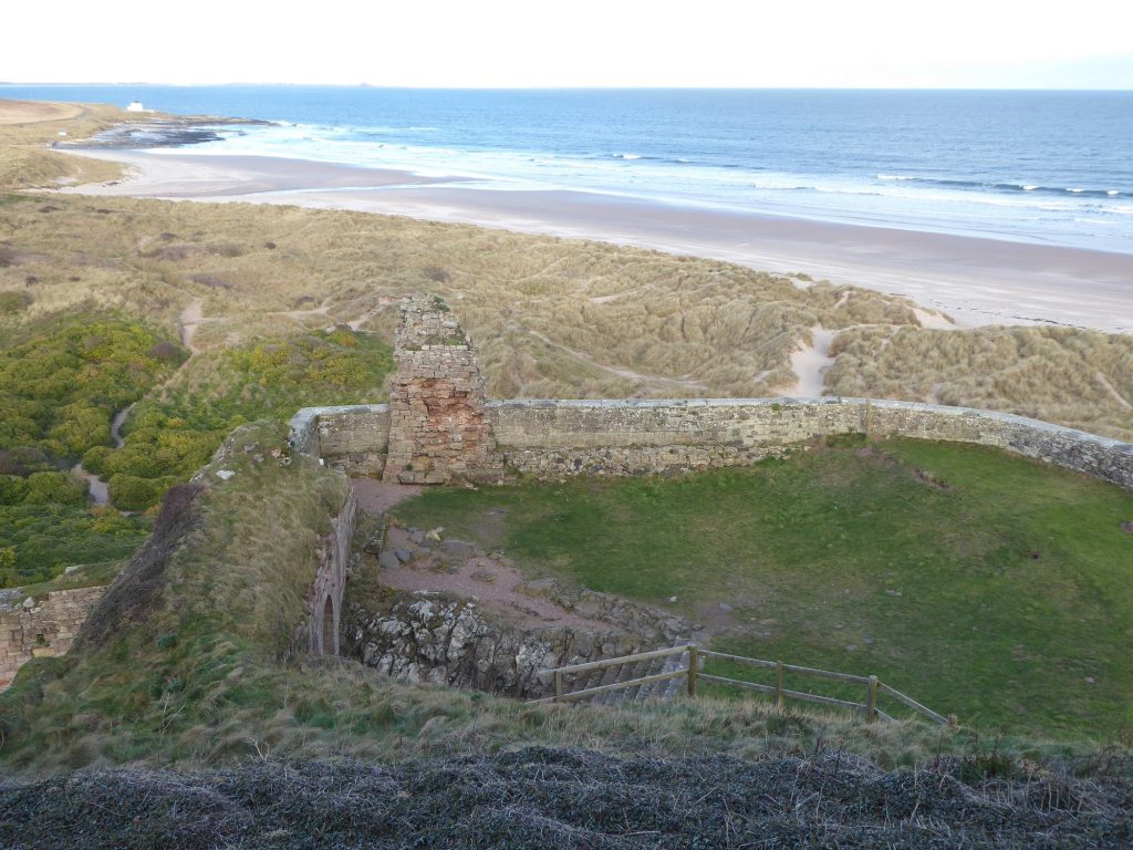 Bamburgh Castle ruins overhead