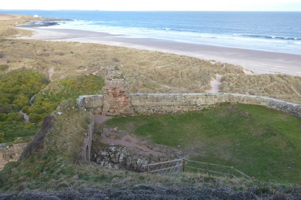 Bamburgh Castle ruins overhead