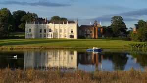 Combermere Abbey across the lake