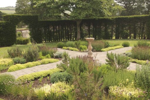 Glenarm Castle garden walkway with sundial