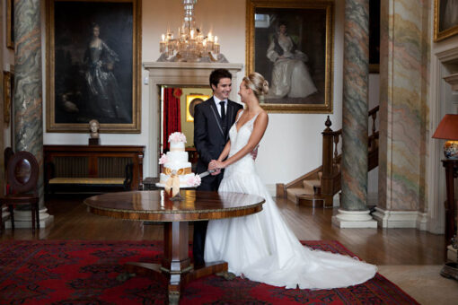 Glenarm Castle wedding couple cutting the cake