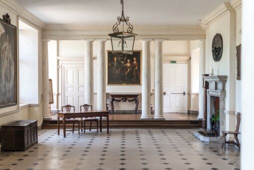 Glynde Place Entrance Hall with fireplace and paintings