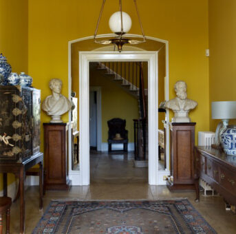 Hardwicke Court door and statues on plinths