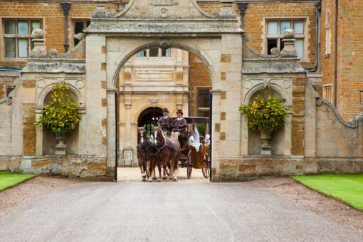 Holdenby House horses and cart leaving the historic gate