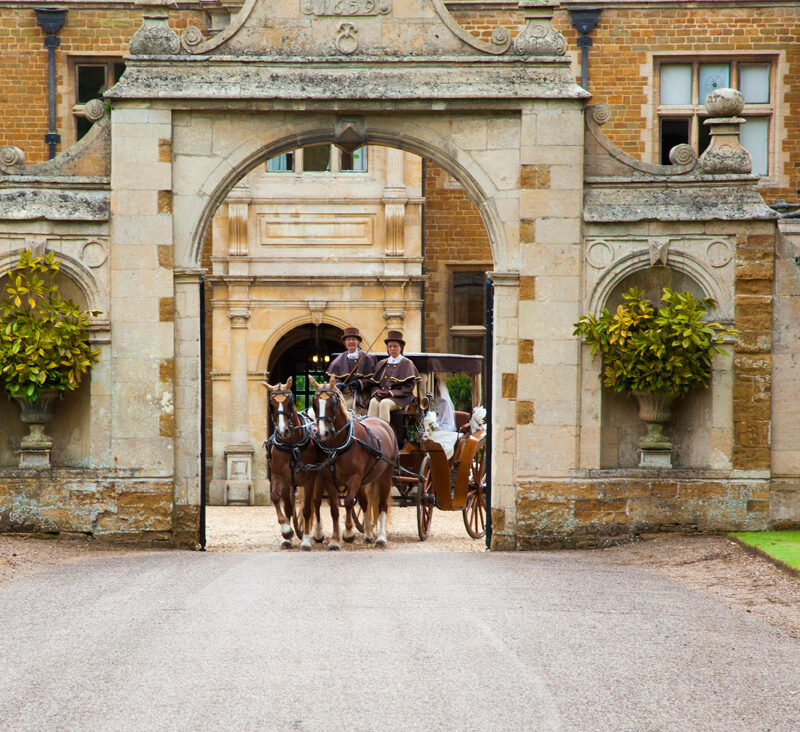 Holdenby House horses and cart leaving the historic gate