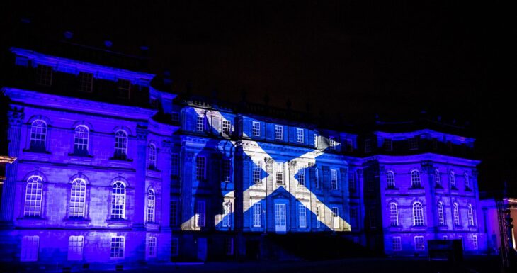 Hopetoun House in Scotland projects the Scottish flag on the walls