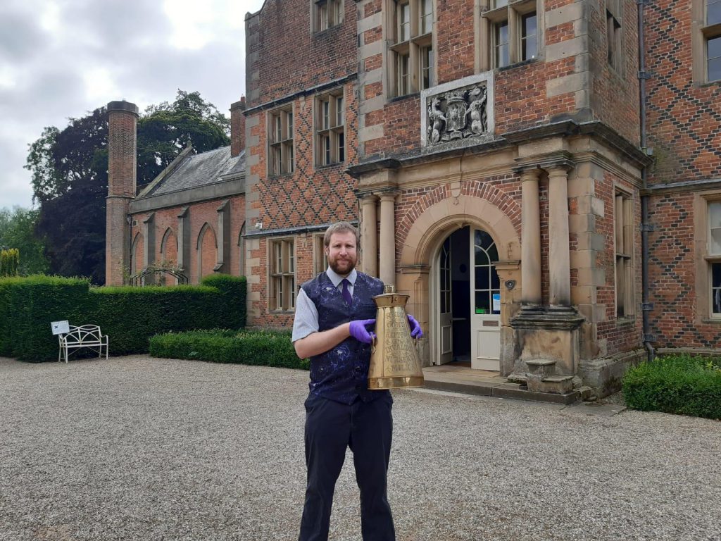 Kiplin Hall and Gardens James Etherington with an artefact