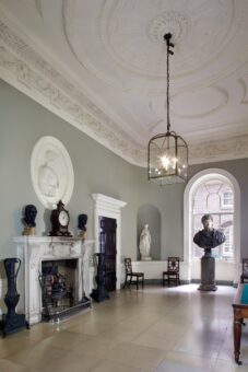Spencer House hall with clock on the fireplace