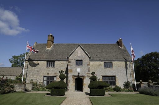 Sulgrave Manor with the American flag and Union Jack