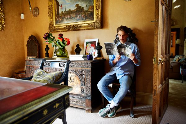 Teenager reading magazine Sudeley