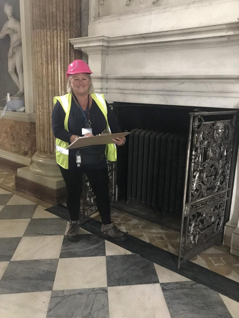 Wentworth Facilities Manager Jule Readman checking central heating radiators