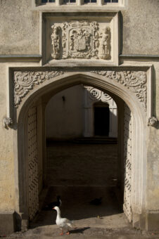 Great Fulford stone arch with carvings