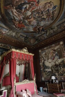 Painted ceiling and bed at Burghley House
