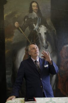 George Drye in front of a painting of Charles II at Lamport Hall