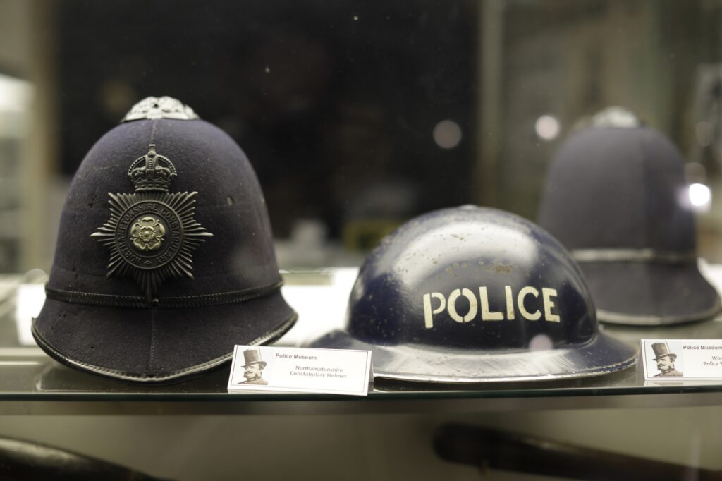 Historic police helmets at Middleton Hall