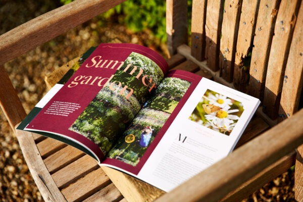 Historic House Magazine on chair in sun