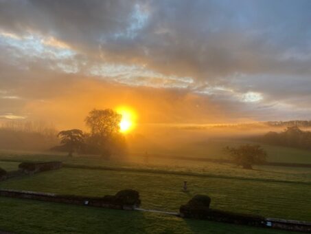 Downes House sun cloud over garden