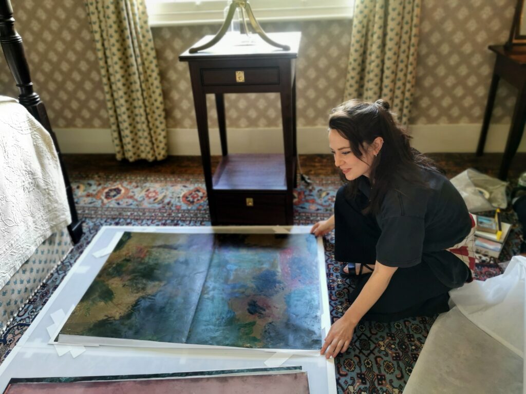 Anna Paterson installing her paintings inspired by Turner and the Thames at Turner's House. Lucinda MacPherson