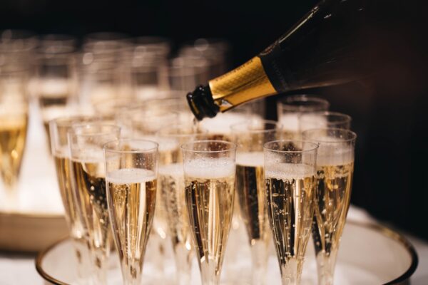 Pouring champagne into a flute party