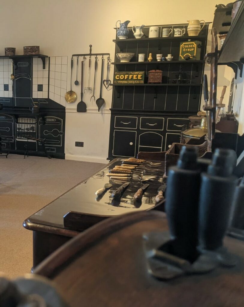 2. A shadowy dresser showcases objects used in domestic service in great houses like Kiplin Hall